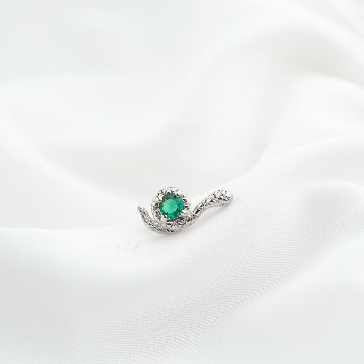 Silver Emerald Curling Snake Stud