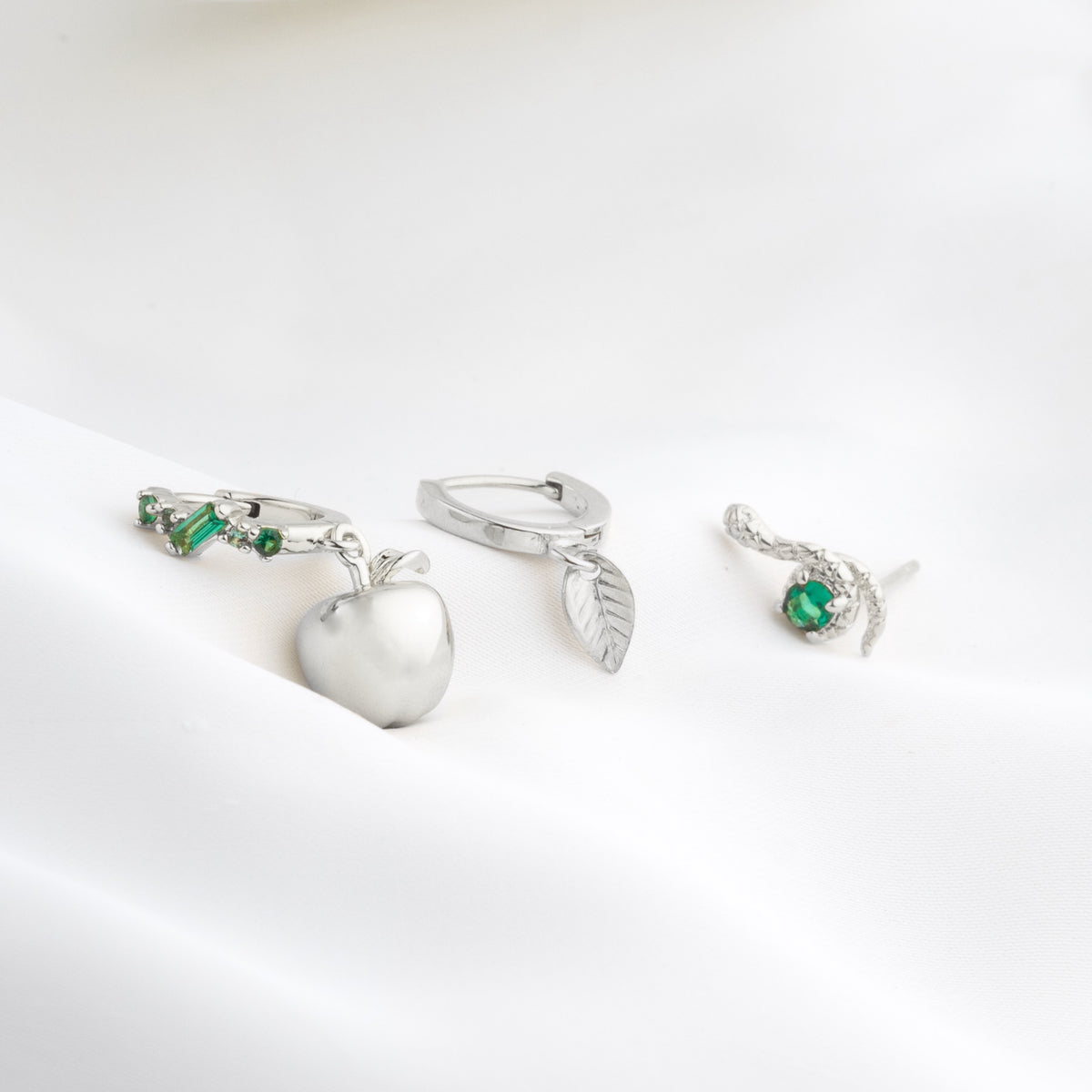 Silver Emerald Curling Snake Stud
